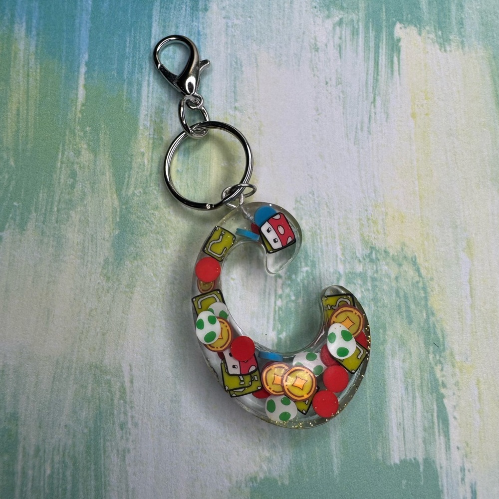 Letter C with video game inspired charms newly made.